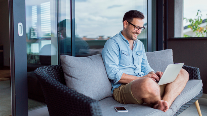 Employee using personal devices used whilst working remotely, on their balcony.