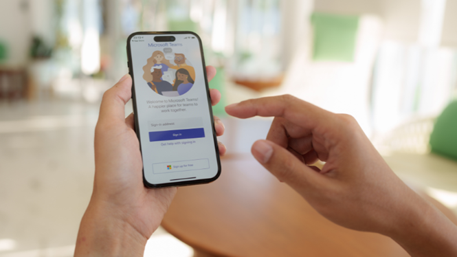 Image of an employee using Microsoft Teams application on a mobile device